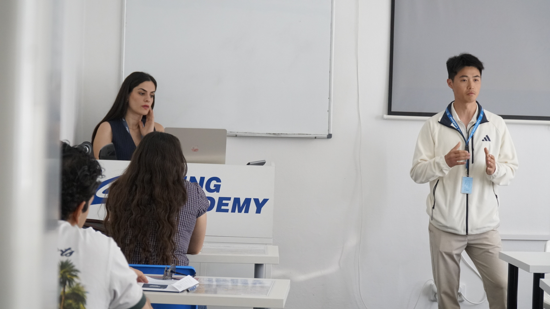 Guests attending a pilot training presentation at Flying Academy Prague